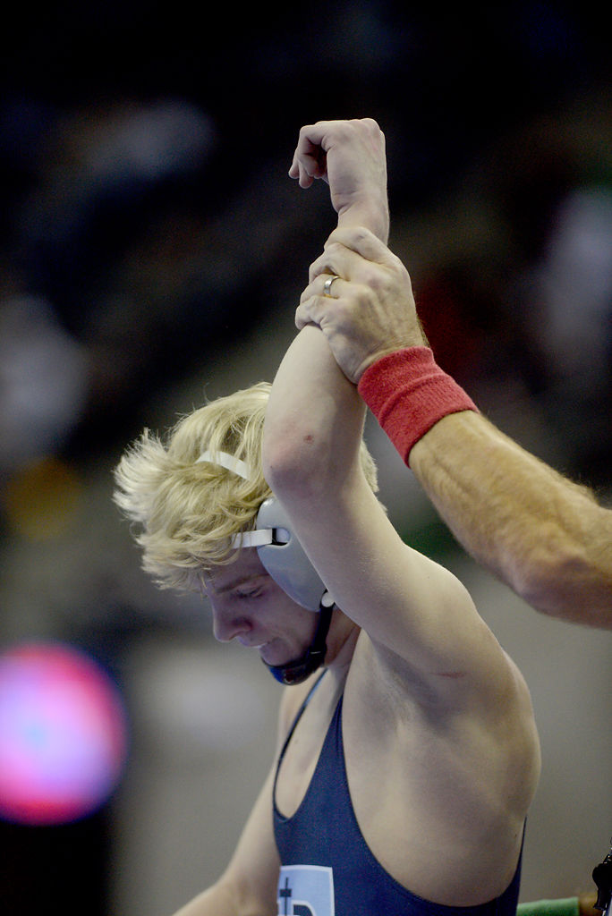 Fr. Tolton Catholic's Teague Travis leaves the ring after his win over Conner Johnston of Knob Noste.jpg